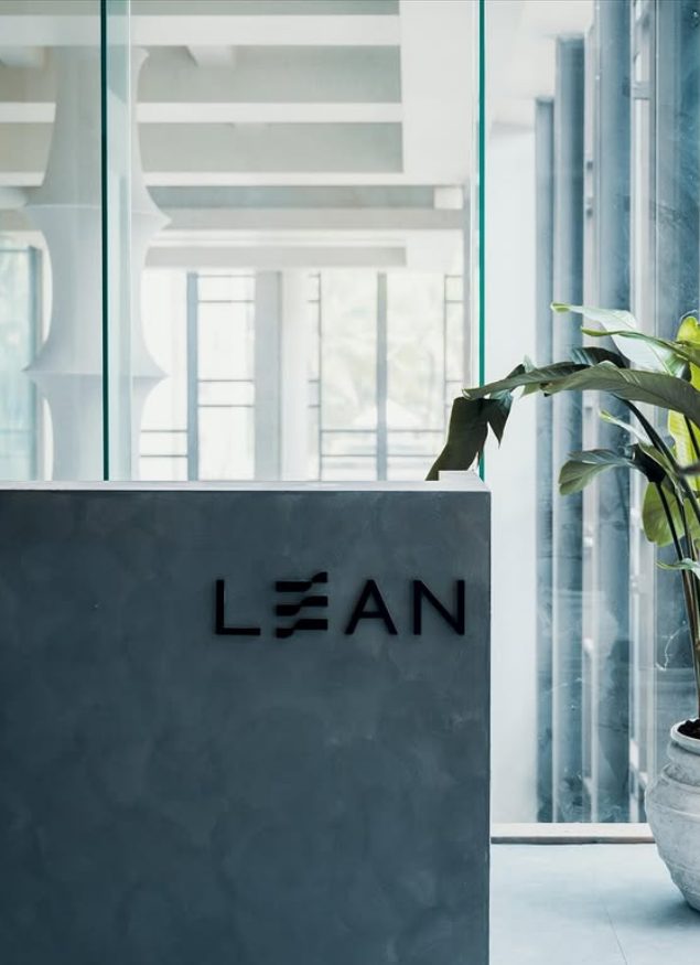 The LEAN wordmark on the studio reception desk